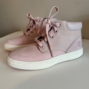 Pink Timberland lace up boots.